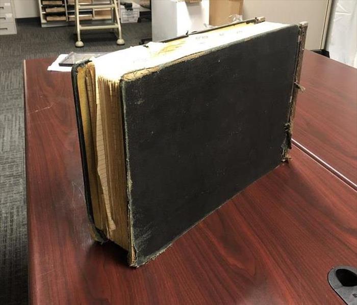 Image shows cleaned black book.